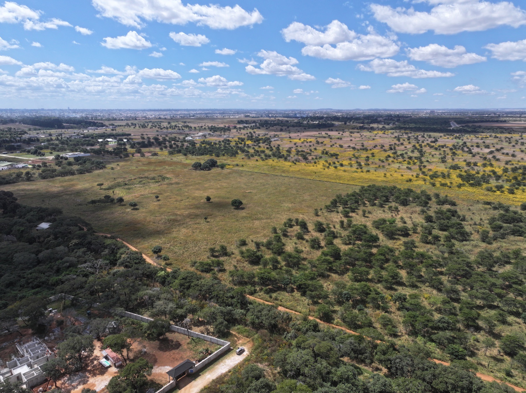 Wide drone view of Parkway City site before land clearing began